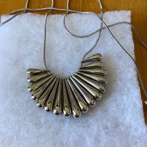 Silver costume jewelry.  Teardrop cluster design.